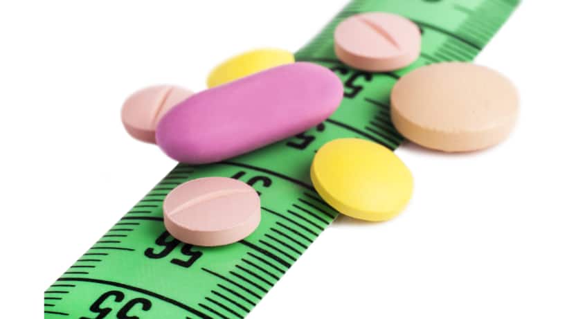 Pills representing weight-loss medications placed over a measuring tape, symbolizing the growing focus on pharmaceutical solutions for obesity management in India.