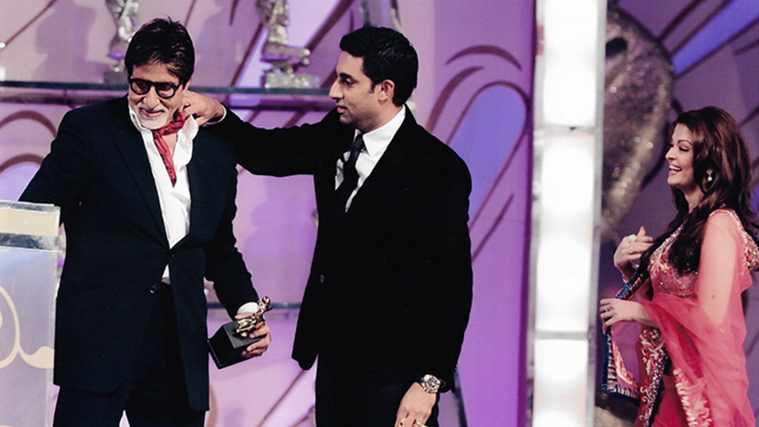 A candid moment of Amitabh Bachchan, Abhishek Bachchan and Aishwarya Rai Bachchan.